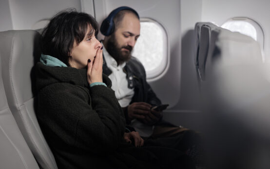 Woman feeling tense and scared about airplane takeoff