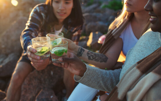 Toasting at beach party